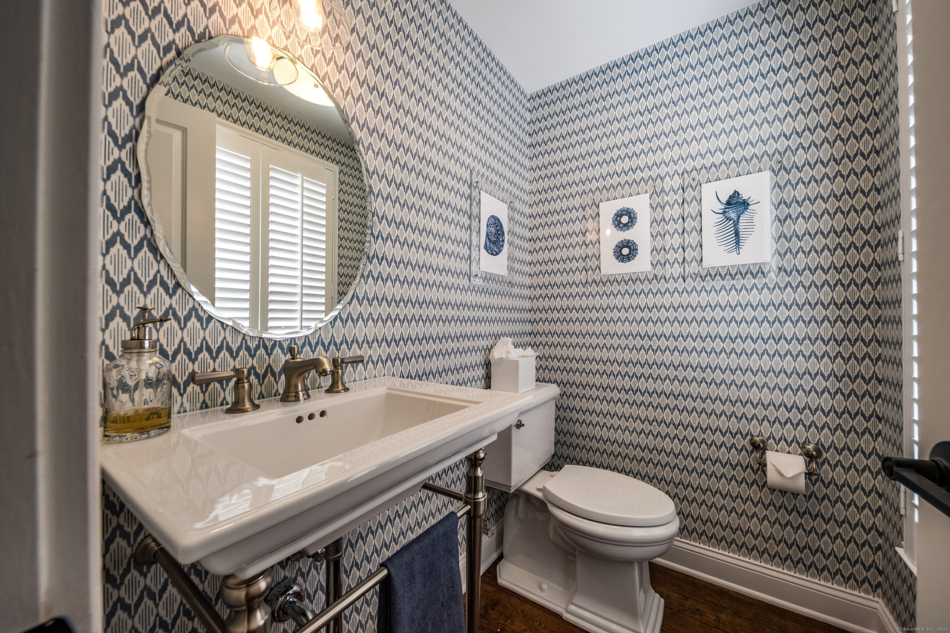137 Liberty Street Madison, CT 06443 - Photo 5 of 40 a bathroom with a sink a toilet and mirror