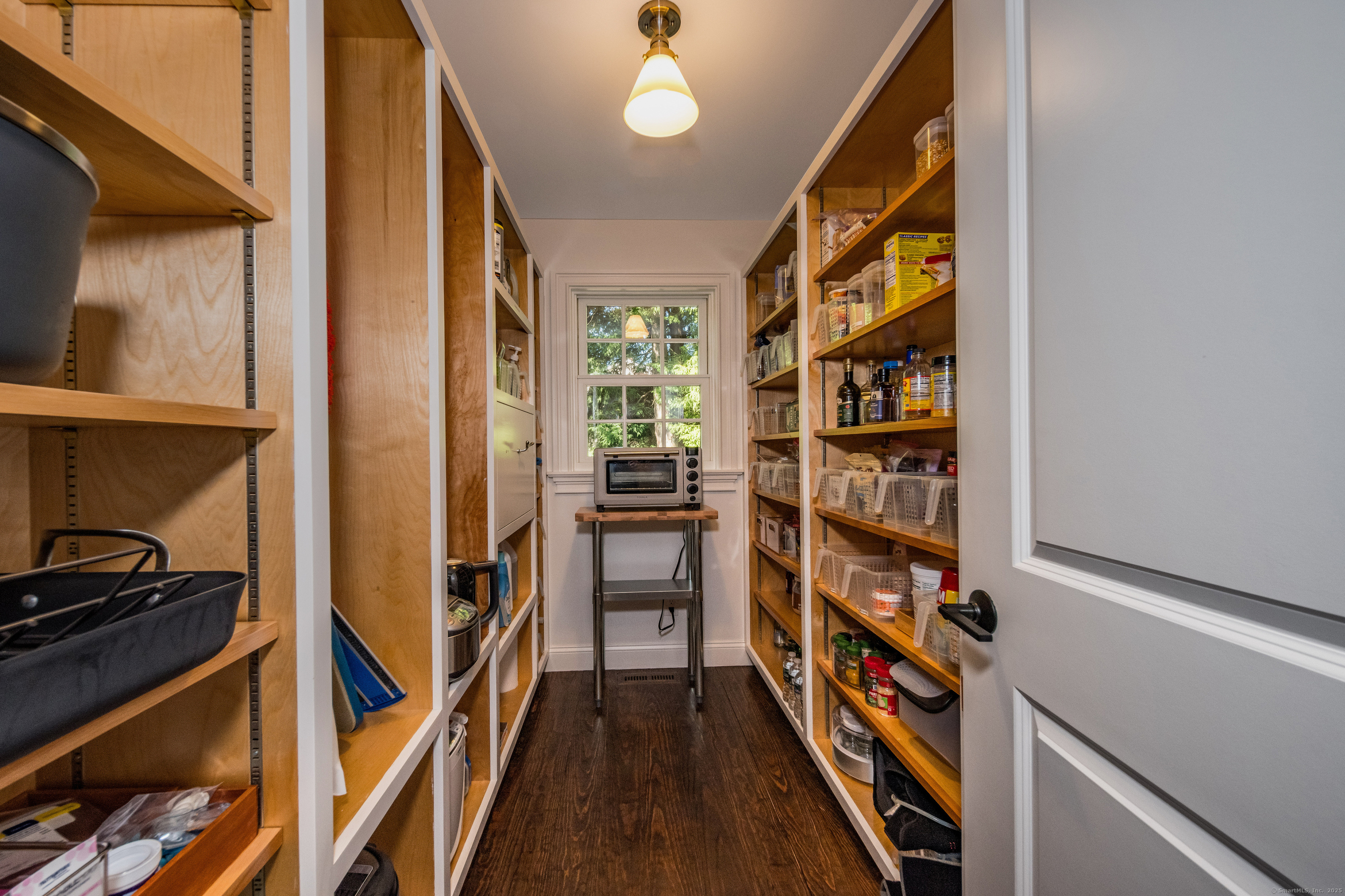 137 Liberty Street Madison, CT 06443 - Photo 7 of 40 a view of walk in closet with clothes and shoes