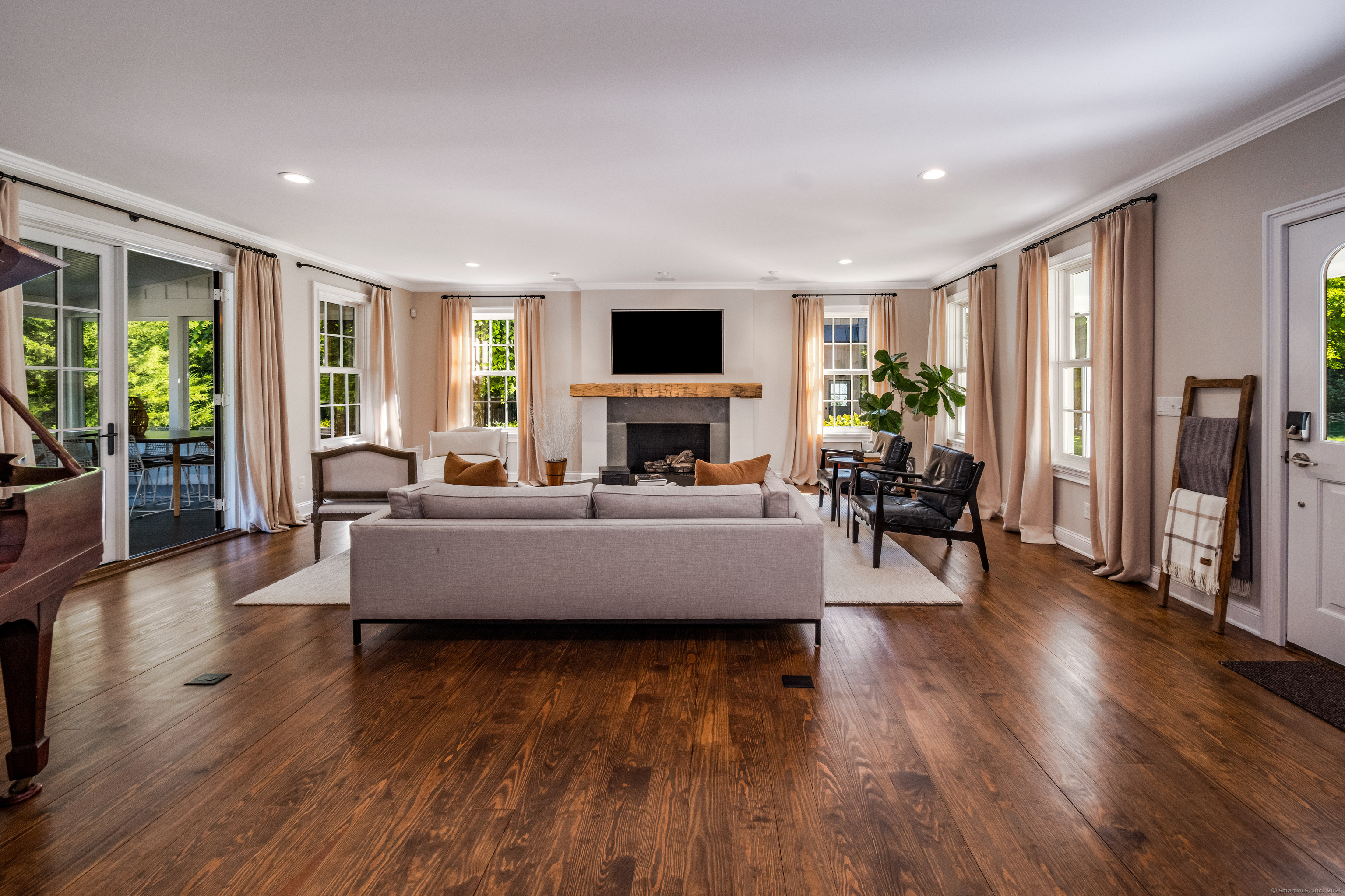137 Liberty Street Madison, CT 06443 - Photo 9 of 40 a living room with furniture wooden floor and a flat screen tv