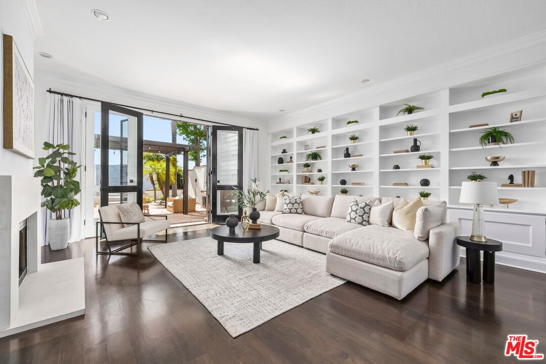 2241 Canyonback Road Los Angeles, CA 90049 - Photo 1 of 26 a living room with furniture and a large window