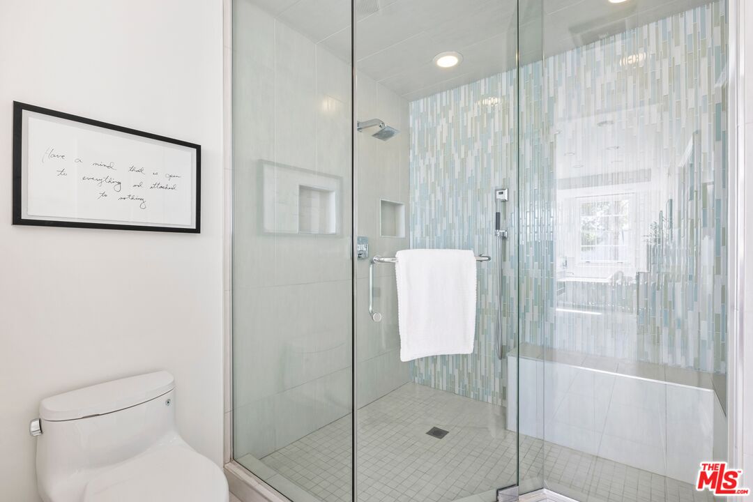 2241 Canyonback Road Los Angeles, CA 90049 - Photo 17 of 26 a bathroom with a shower and toilet
