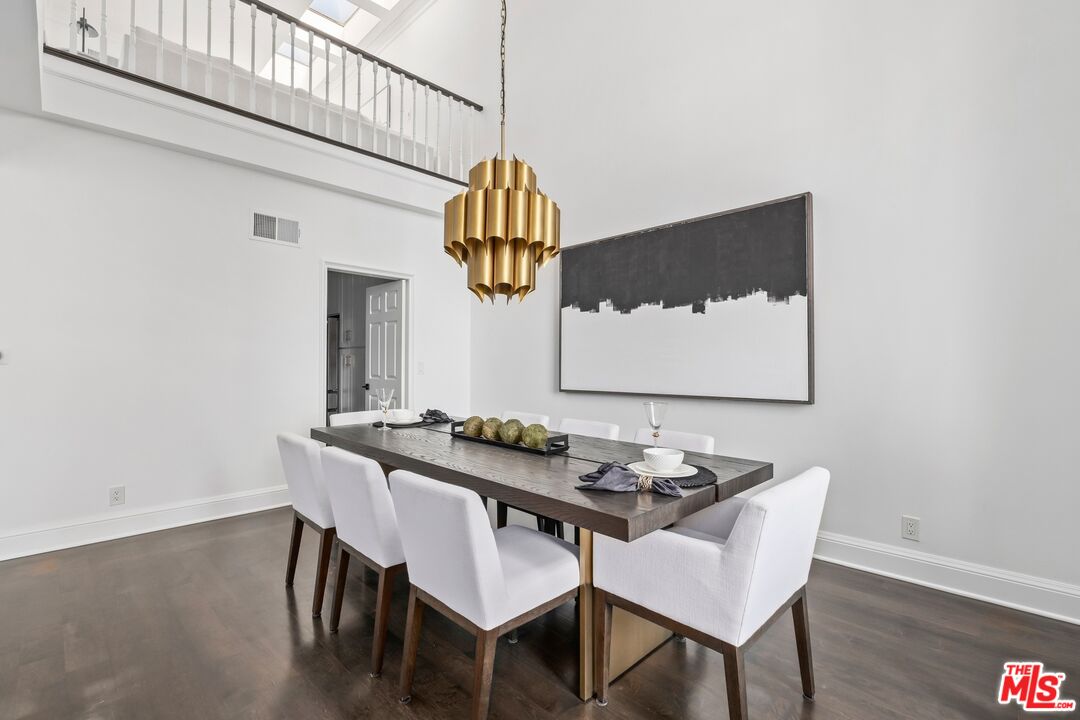 2241 Canyonback Road Los Angeles, CA 90049 - Photo 5 of 26 a table and chairs in a room
