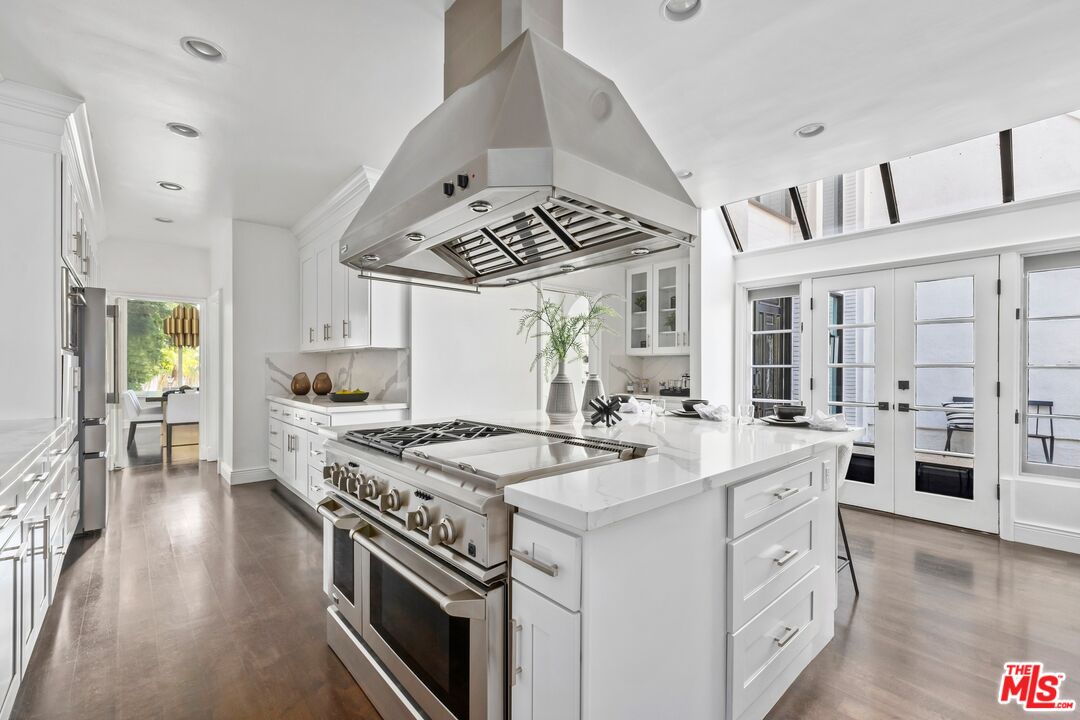 2241 Canyonback Road Los Angeles, CA 90049 - Photo 7 of 26 a kitchen with a stove a sink and a refrigerator