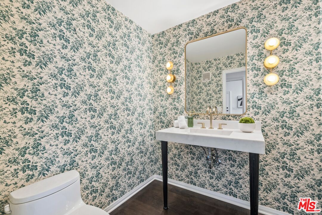 2241 Canyonback Road Los Angeles, CA 90049 - Photo 10 of 26 a bathroom with a sink and a toilet