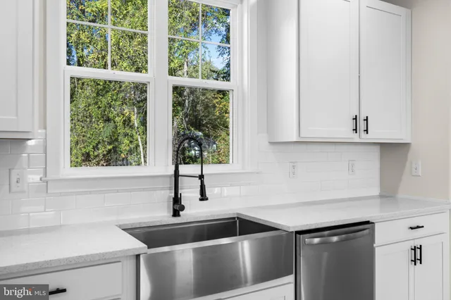 a kitchen that has a sink and a window