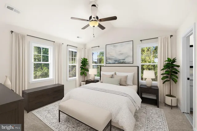 a bedroom with a large bed and a window