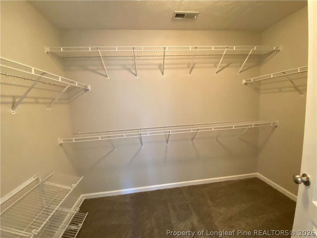 58 Polk Street Spring Lake, NC 28390 - Photo 14 of 26 a view of a room with racks on the wall