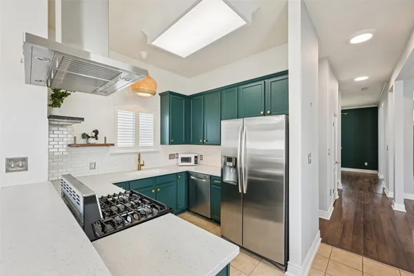 a kitchen with a stove and a sink
