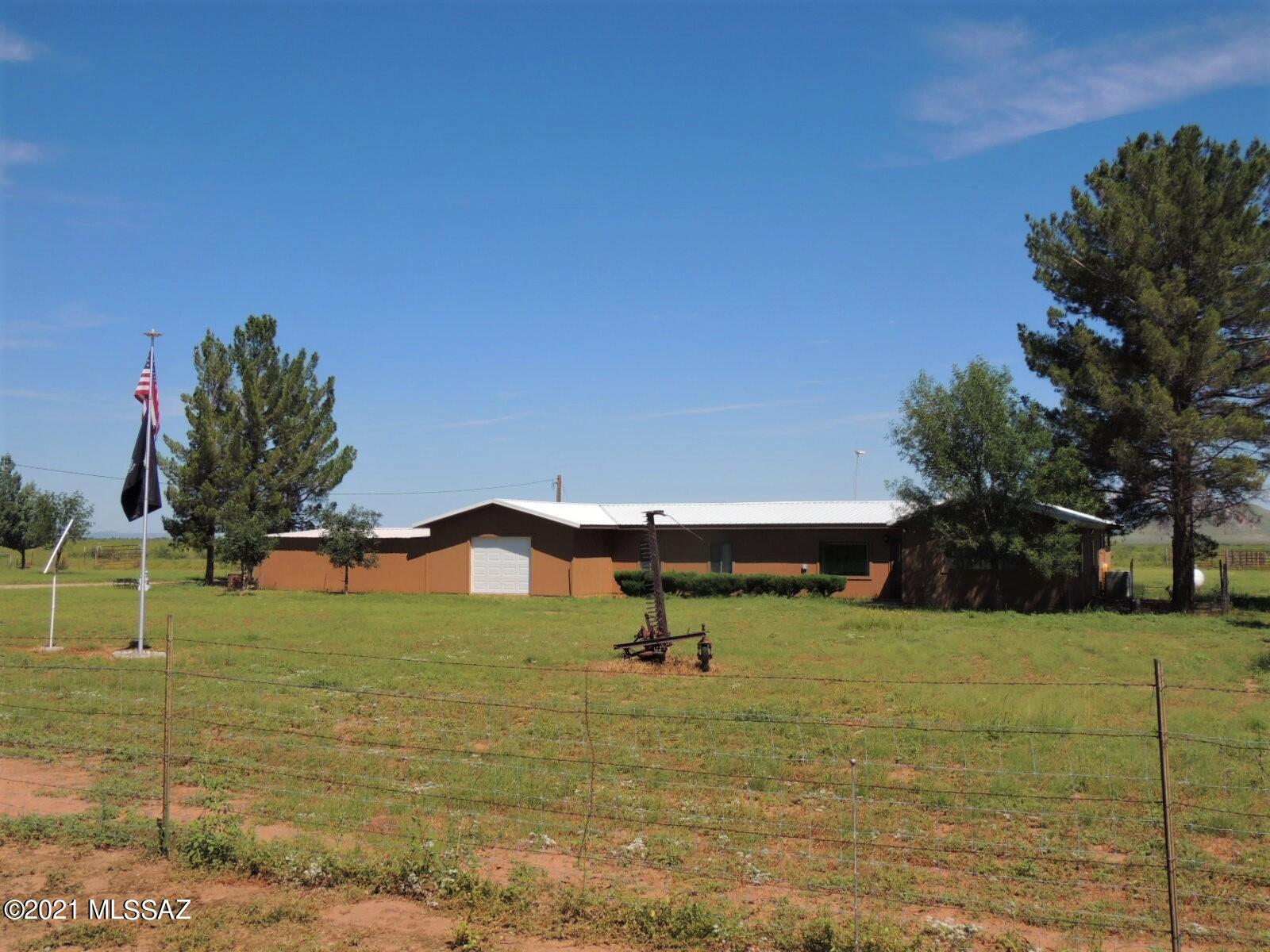 3454 East Fawn Ranch Road Pearce, AZ 85625 - Photo 1 of 49 a view of a lake with a yard