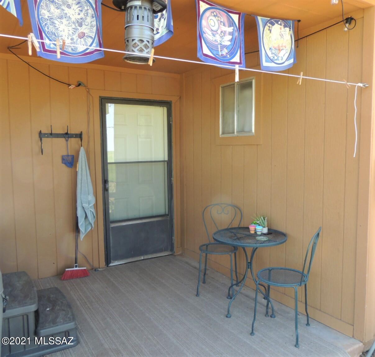 3454 East Fawn Ranch Road Pearce, AZ 85625 - Photo 12 of 49 a view of a door and chair in a room