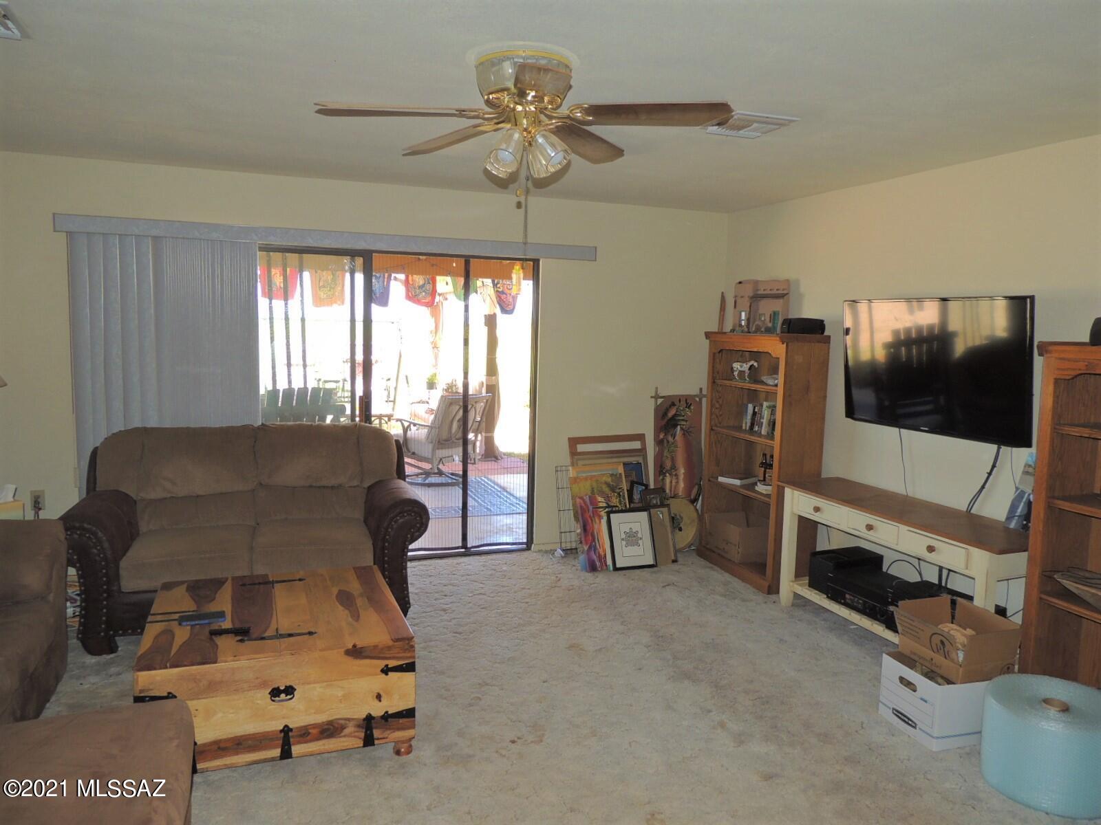 3454 East Fawn Ranch Road Pearce, AZ 85625 - Photo 13 of 49 a bedroom with furniture and a flat screen tv