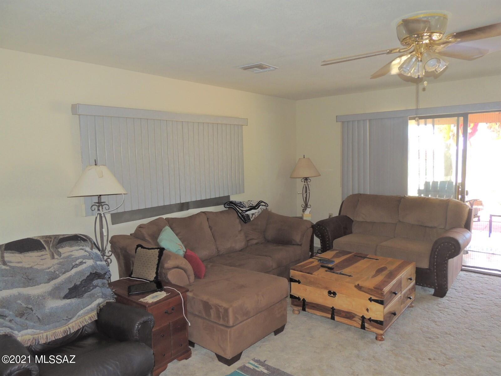 3454 East Fawn Ranch Road Pearce, AZ 85625 - Photo 14 of 49 a living room with furniture and a window