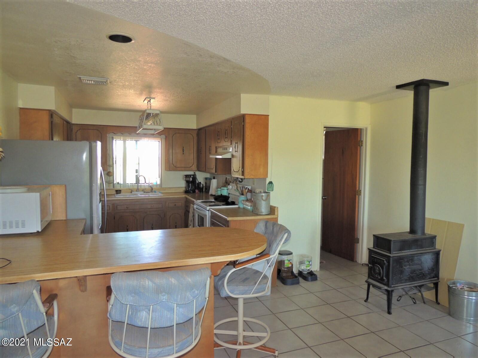 3454 East Fawn Ranch Road Pearce, AZ 85625 - Photo 17 of 49 a view of a dining room with furniture