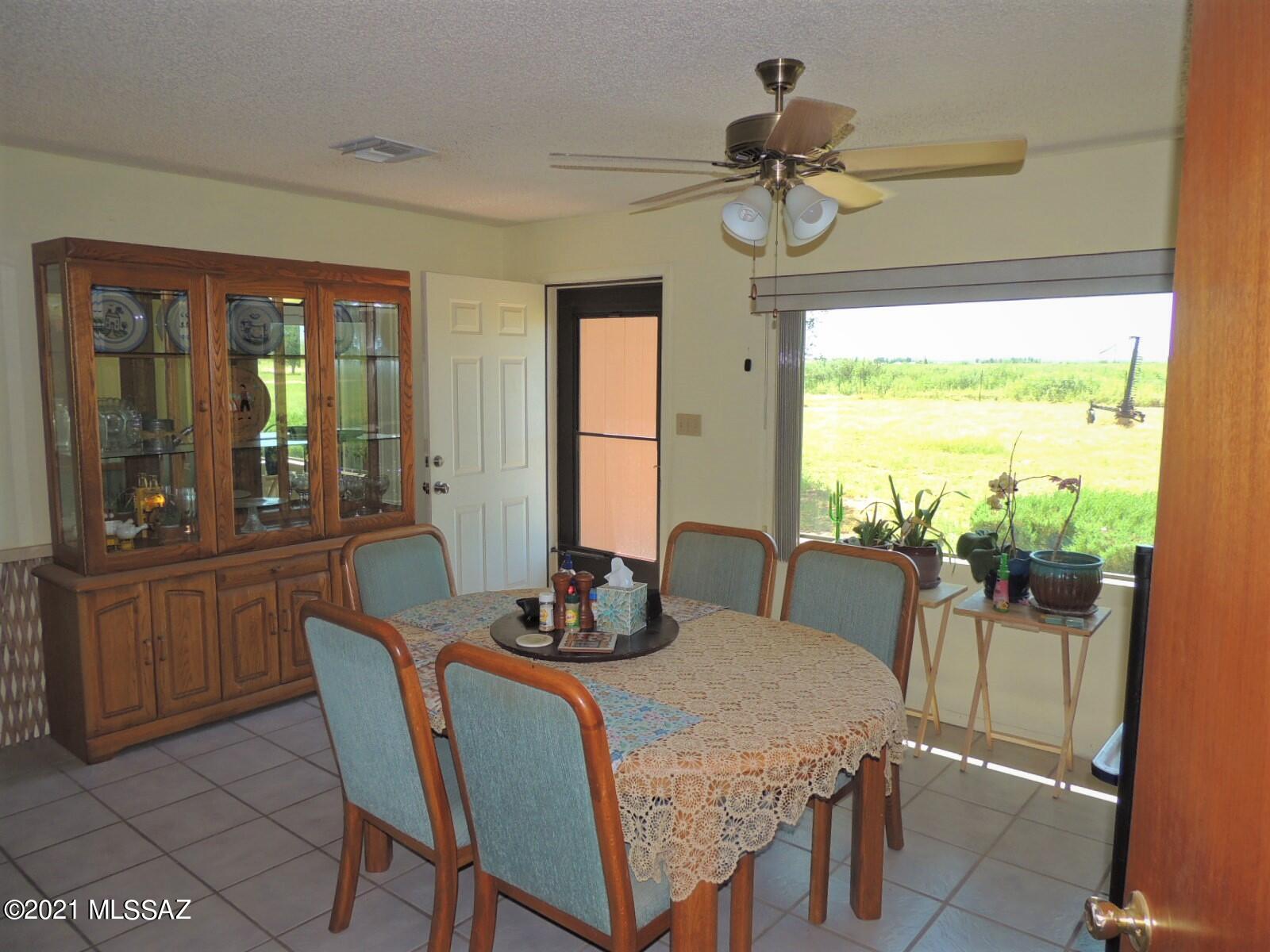 3454 East Fawn Ranch Road Pearce, AZ 85625 - Photo 20 of 49 a dining room with furniture and window