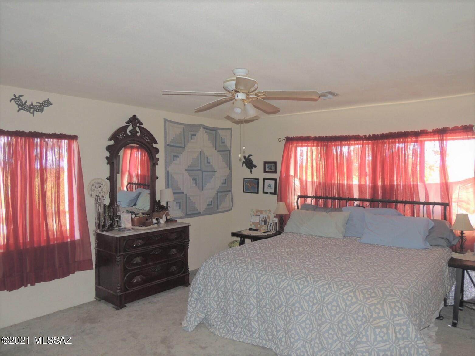 3454 East Fawn Ranch Road Pearce, AZ 85625 - Photo 21 of 49 a bed room with a bed and a window