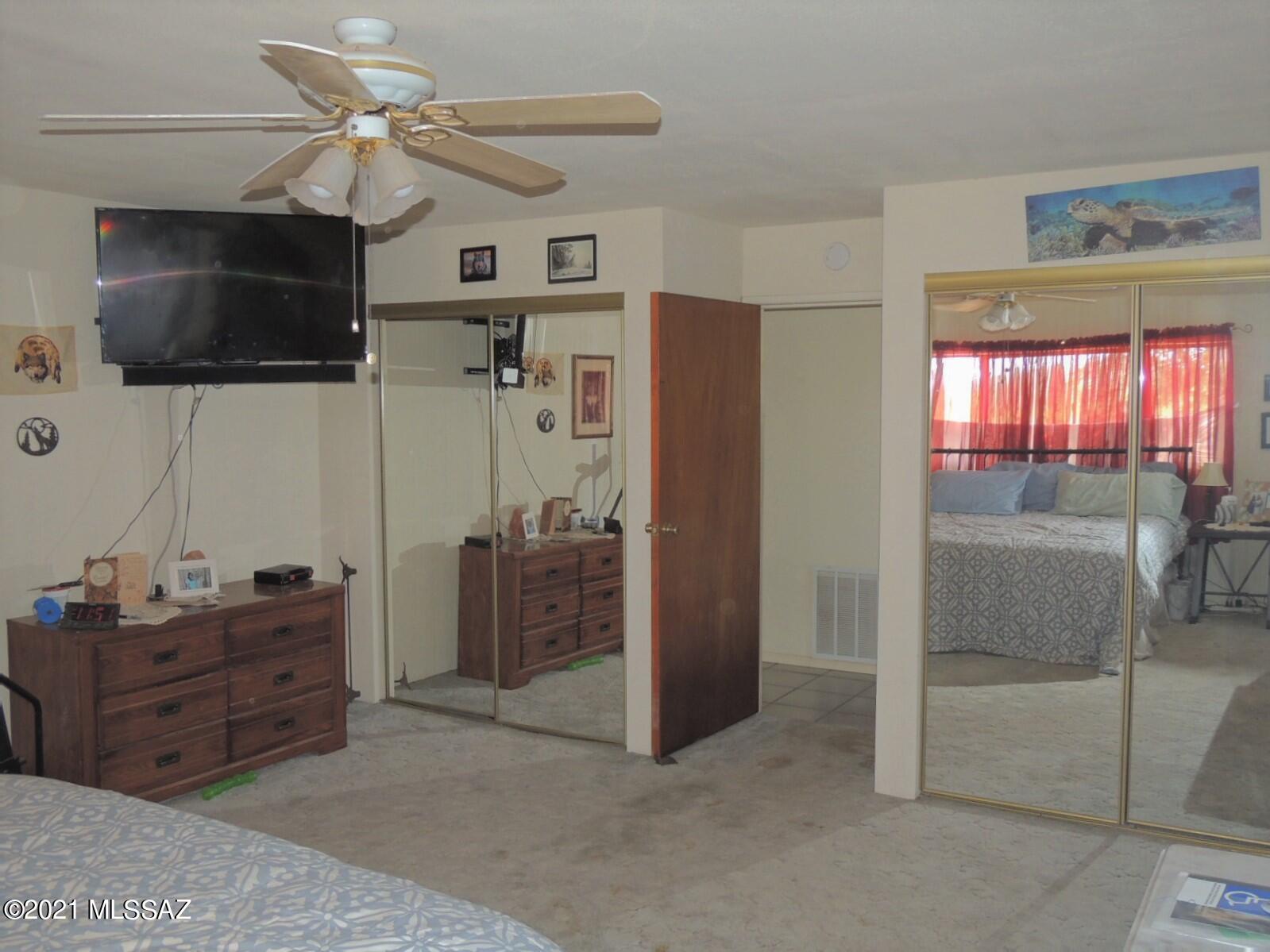 3454 East Fawn Ranch Road Pearce, AZ 85625 - Photo 23 of 49 a view of room with workspace and a ceiling fan