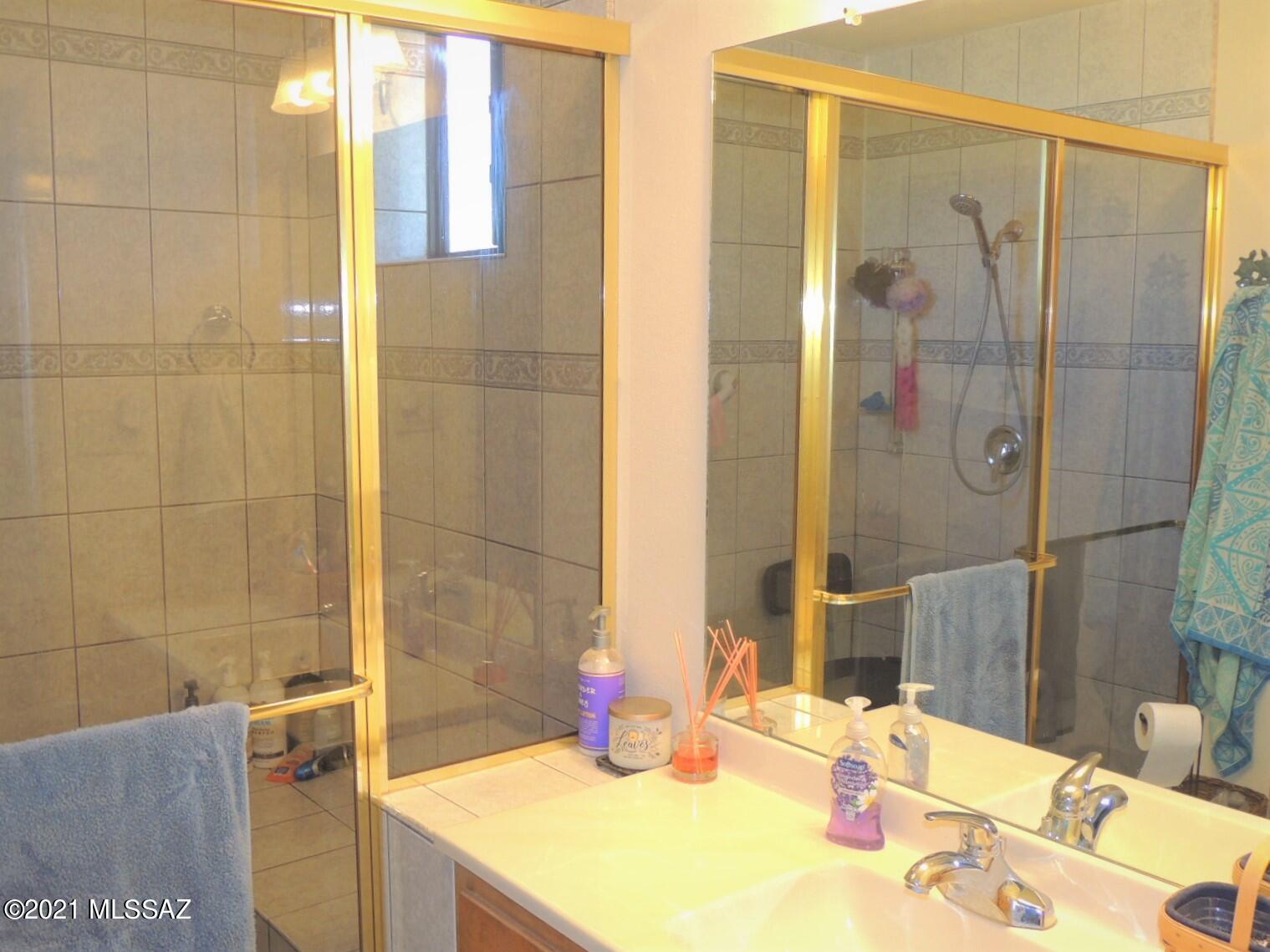 3454 East Fawn Ranch Road Pearce, AZ 85625 - Photo 24 of 49 a bathroom with a sink and a mirror