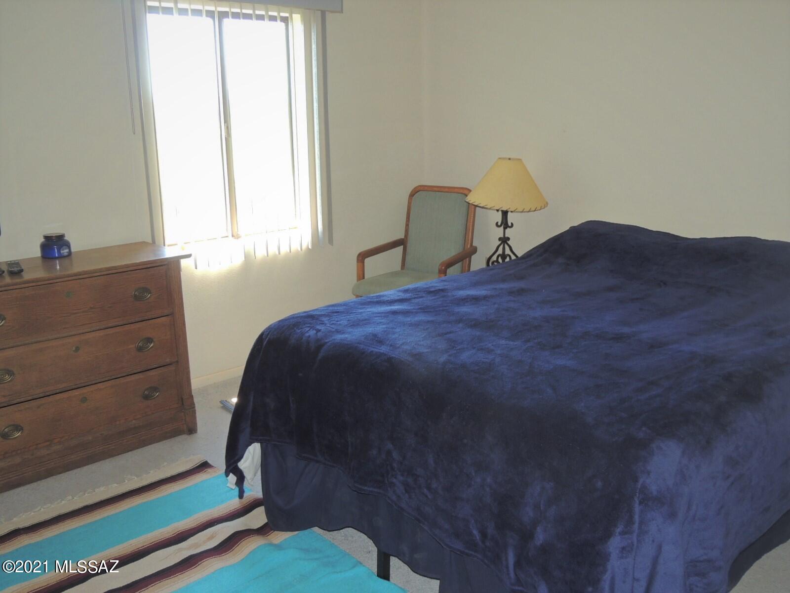 3454 East Fawn Ranch Road Pearce, AZ 85625 - Photo 26 of 49 a bedroom with a bed and a window
