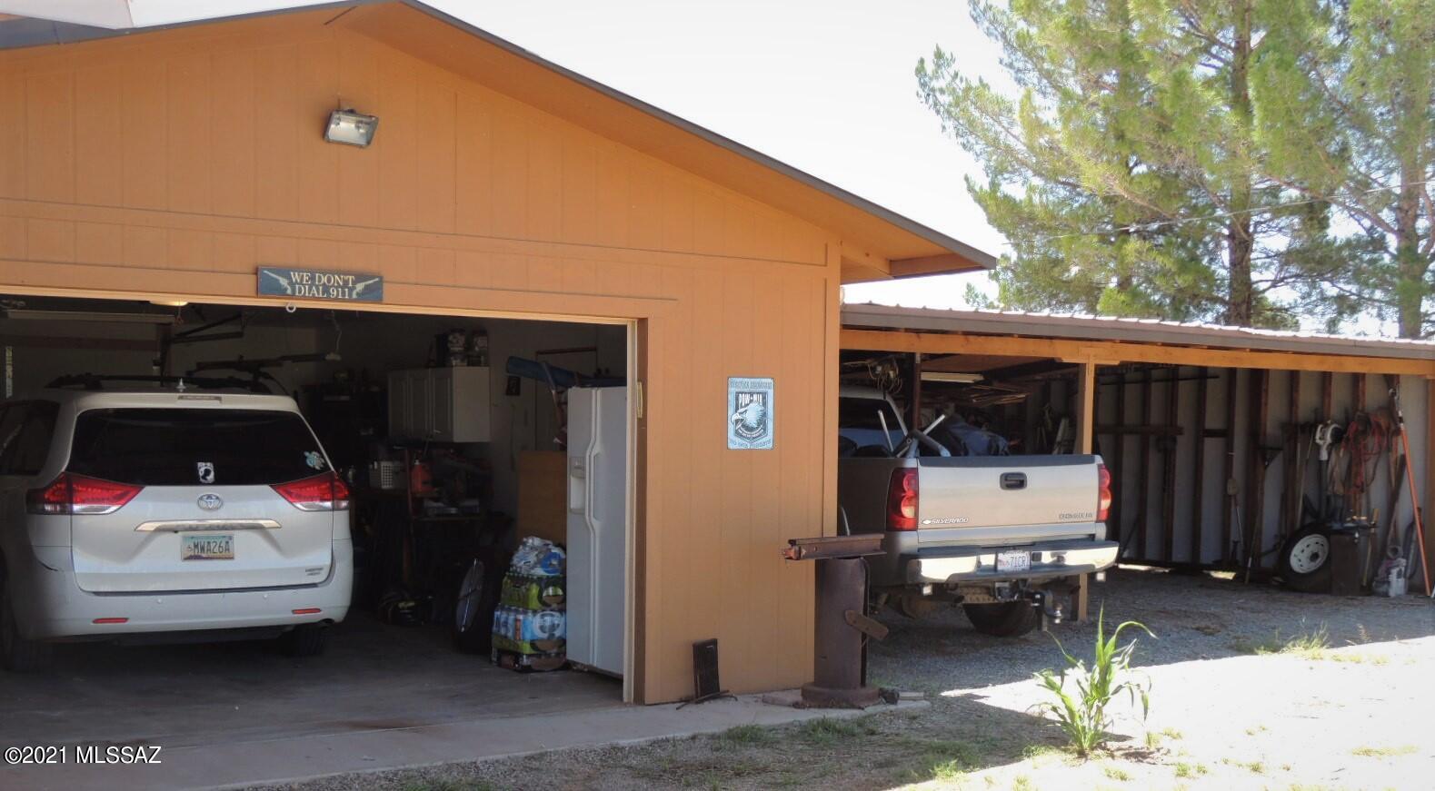 3454 East Fawn Ranch Road Pearce, AZ 85625 - Photo 35 of 49 a car parked in front of a house
