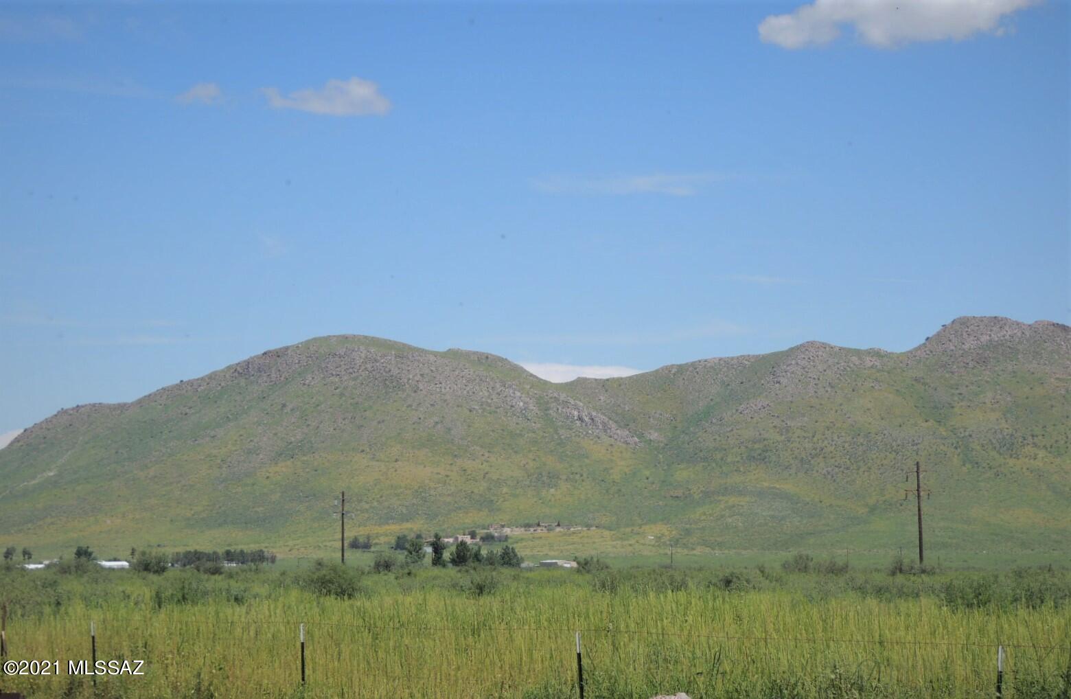 3454 East Fawn Ranch Road Pearce, AZ 85625 - Photo 42 of 49 a view of a lake with a mountain in the background