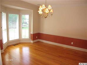 448 South Sharon Amity Road Charlotte, NC 28211 - Photo 4 of 16 a view of empty room with wooden floor and fan