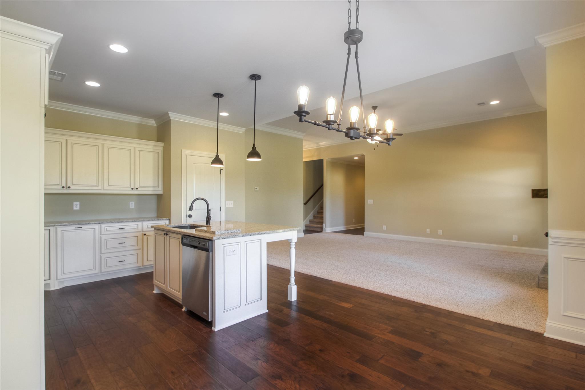 1 Bates Road Lebanon, TN 37087 - Photo 5 of 15 a kitchen with stainless steel appliances granite countertop a sink a stove a refrigerator and island with wooden floor