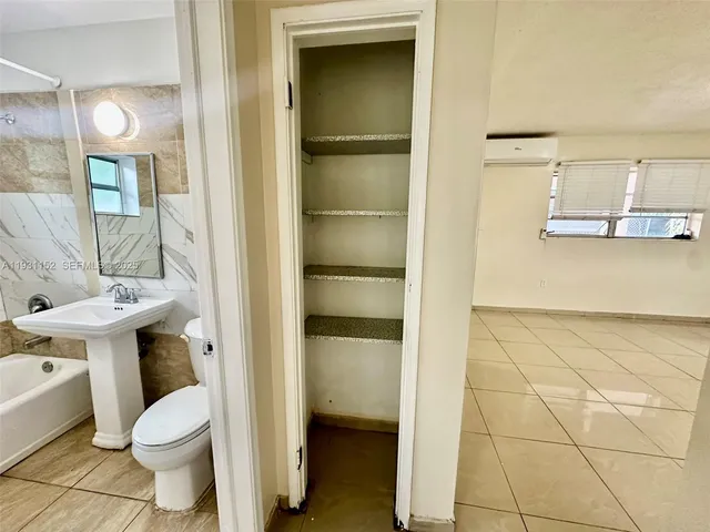a bathroom with a toilet and a sink