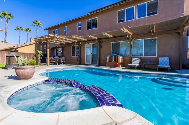 a view of a house with outdoor seating