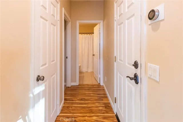 a living room with furniture and large windows