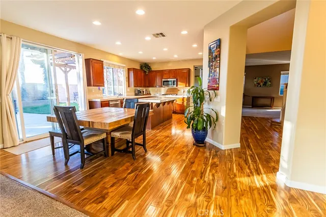 a living room with fireplace furniture and a flat screen tv