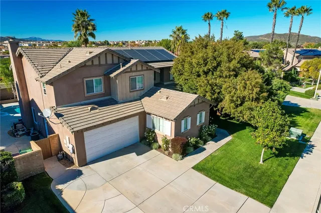a aerial view of a house with a yard