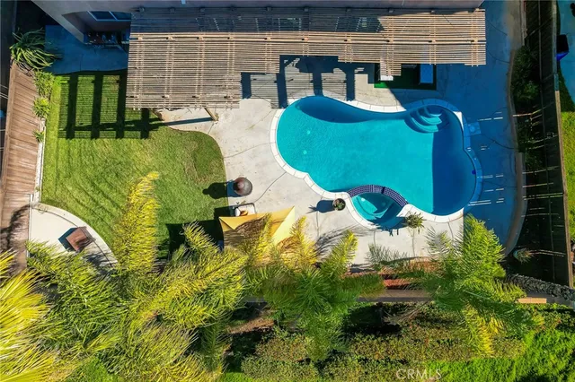 a view of a swimming pool with a wooden bench