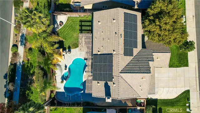 an aerial view of a house with a garden