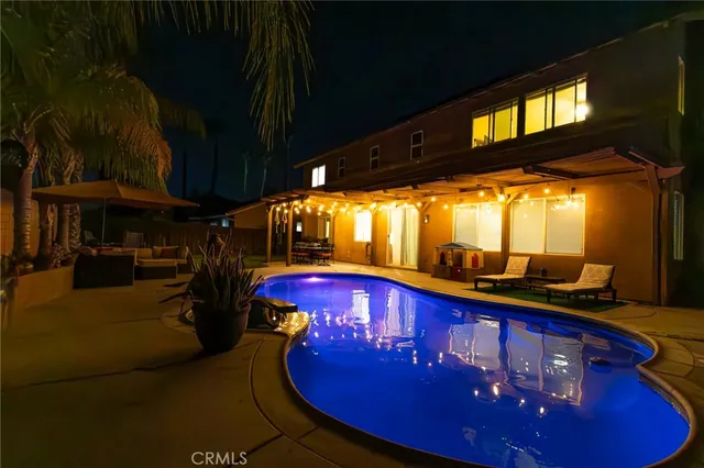 a view of a chairs and table in the patio