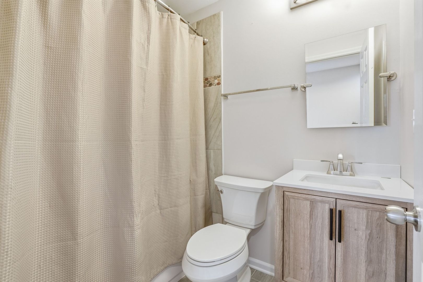 221 Davis Lane Bolingbrook, IL 60440 - Photo 12 of 24 a bathroom with a sink a toilet and a mirror
