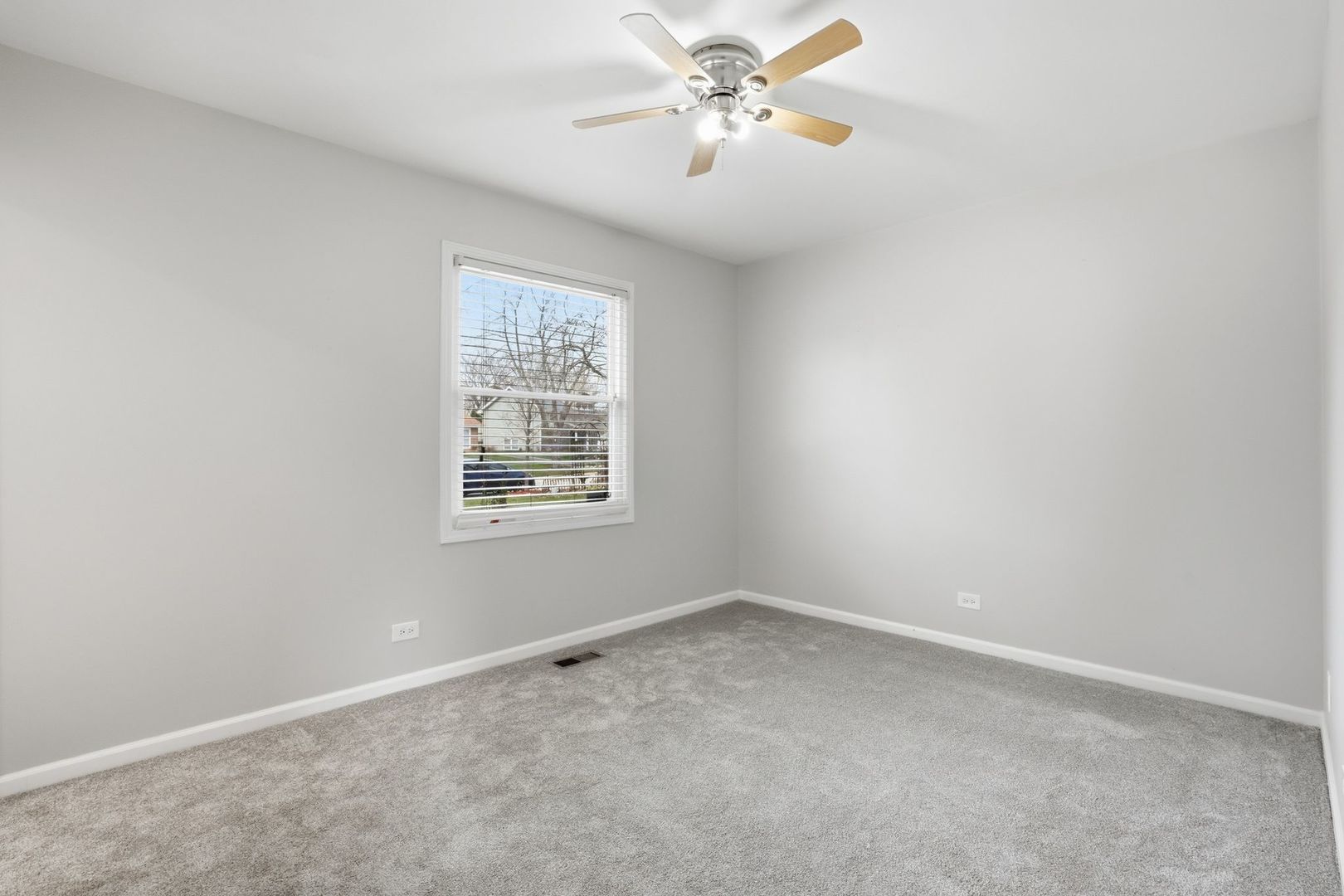 221 Davis Lane Bolingbrook, IL 60440 - Photo 13 of 24 an empty room with a window and a fan