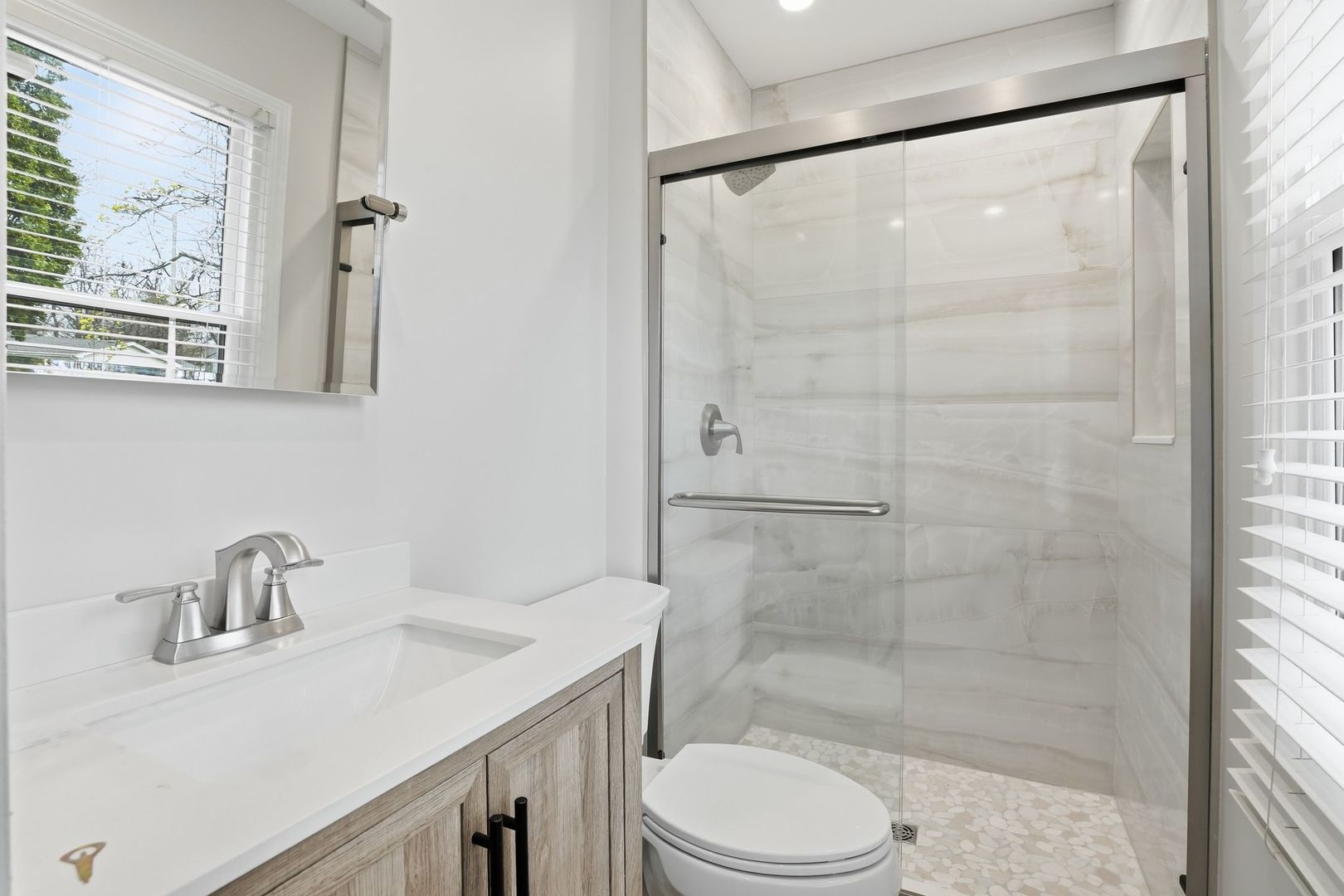 221 Davis Lane Bolingbrook, IL 60440 - Photo 17 of 24 a bathroom with a sink and a mirror