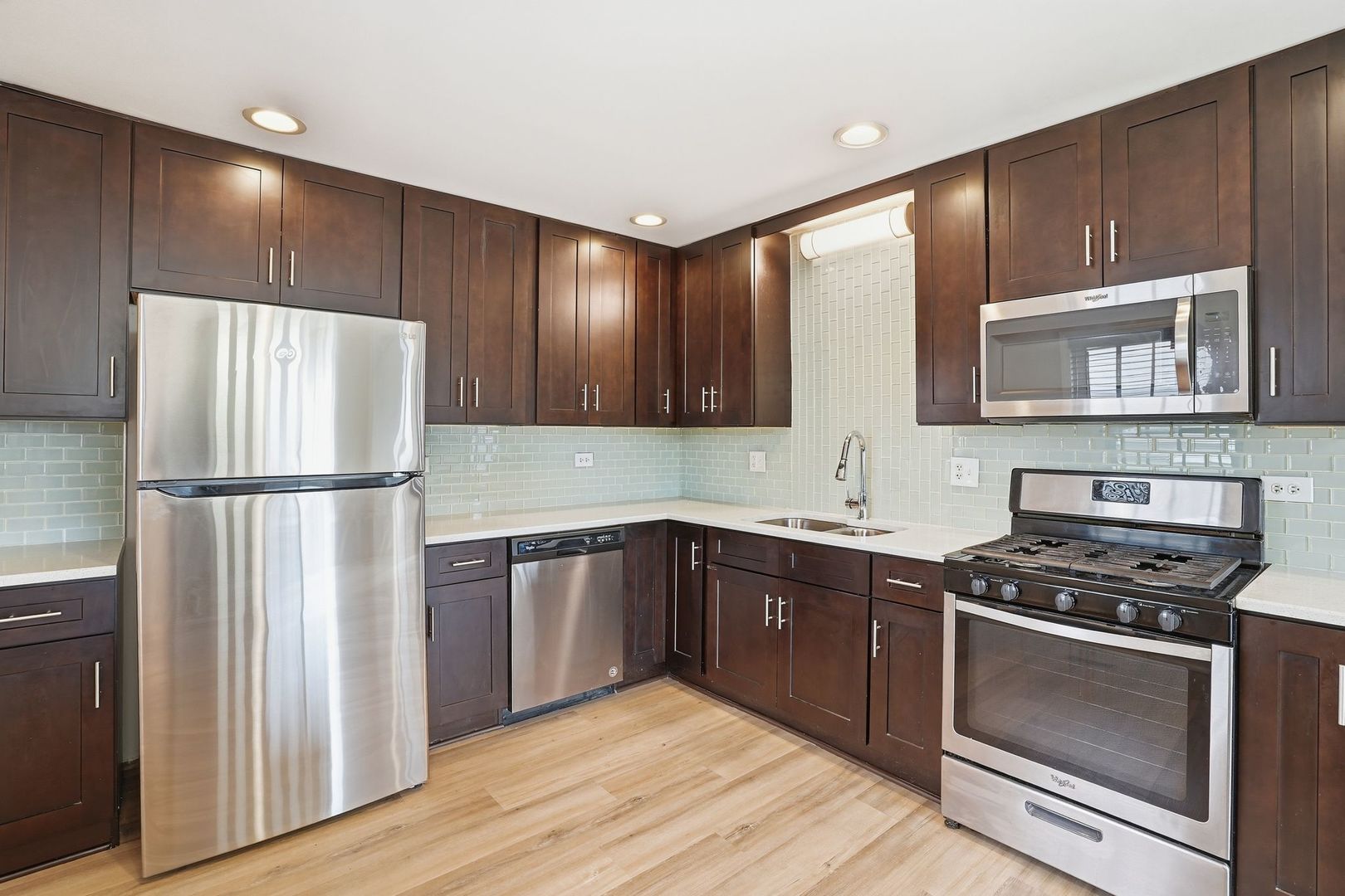 221 Davis Lane Bolingbrook, IL 60440 - Photo 7 of 24 a kitchen with stainless steel appliances granite countertop a refrigerator and a stove top oven