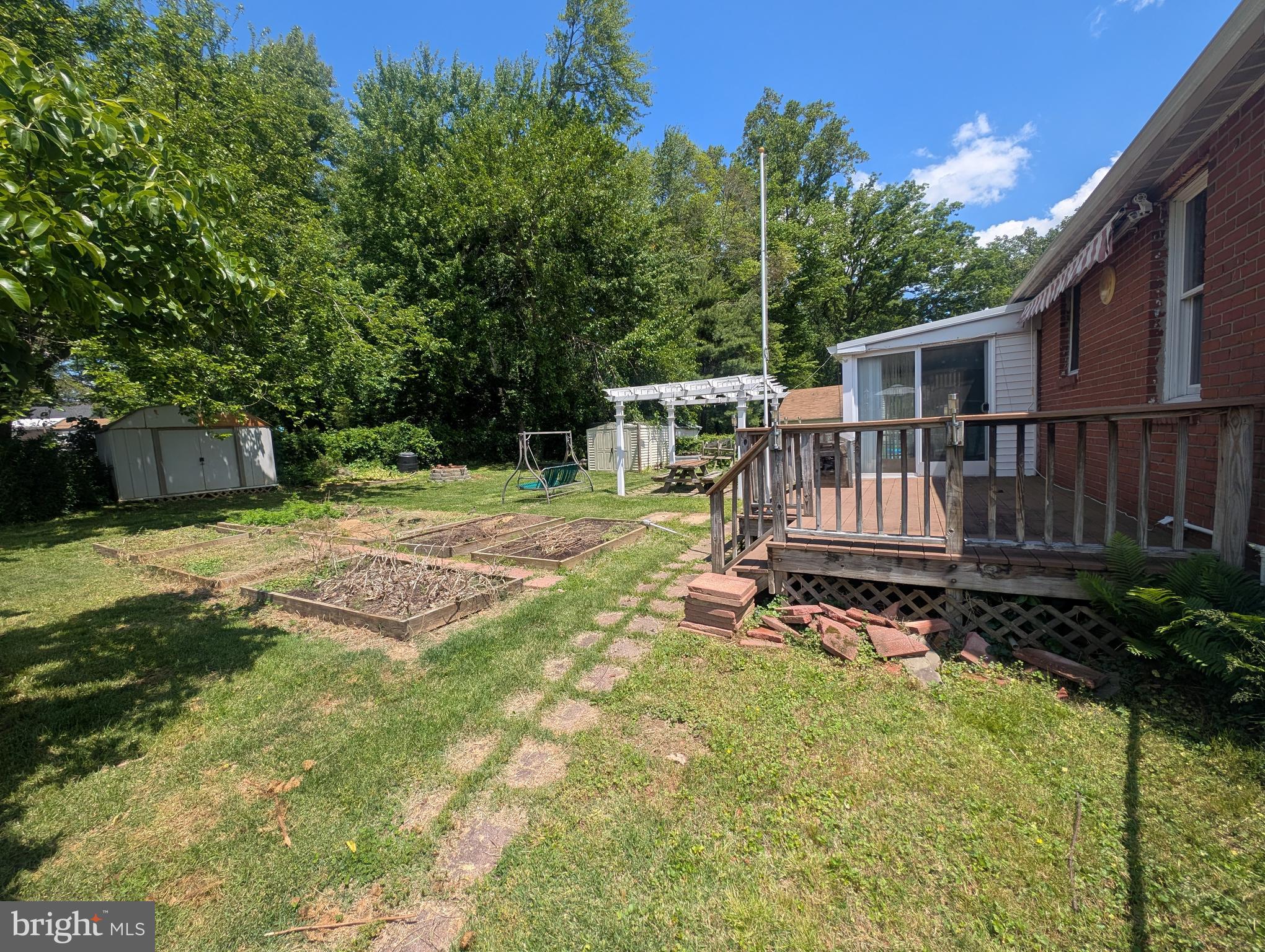 1129 Providence Road Springfield, PA 19064 - Photo 11 of 15 a view of a house with backyard porch and sitting area