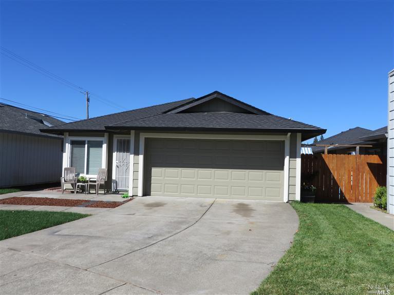 1903 Genoa Place Santa Rosa, CA 95403 - Photo 1 of 1 a front view of a house with a yard and garage