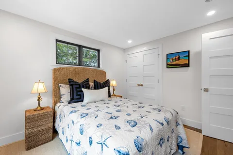 a bedroom with a bed and a lamp