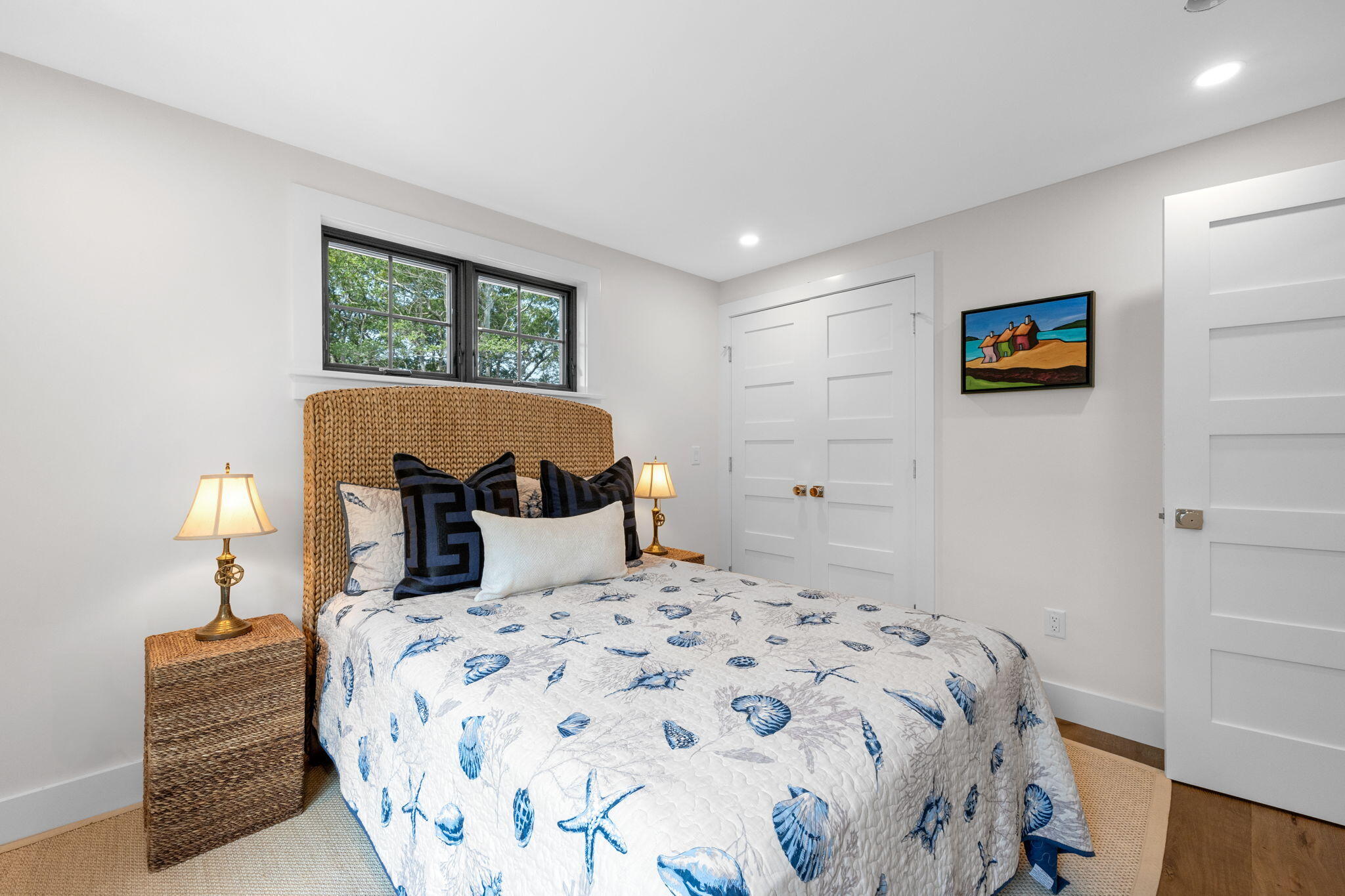 50 Nelson Avenue, Unit 8 Provincetown, MA 02657 - Photo 14 of 21 a bedroom with a bed and a lamp