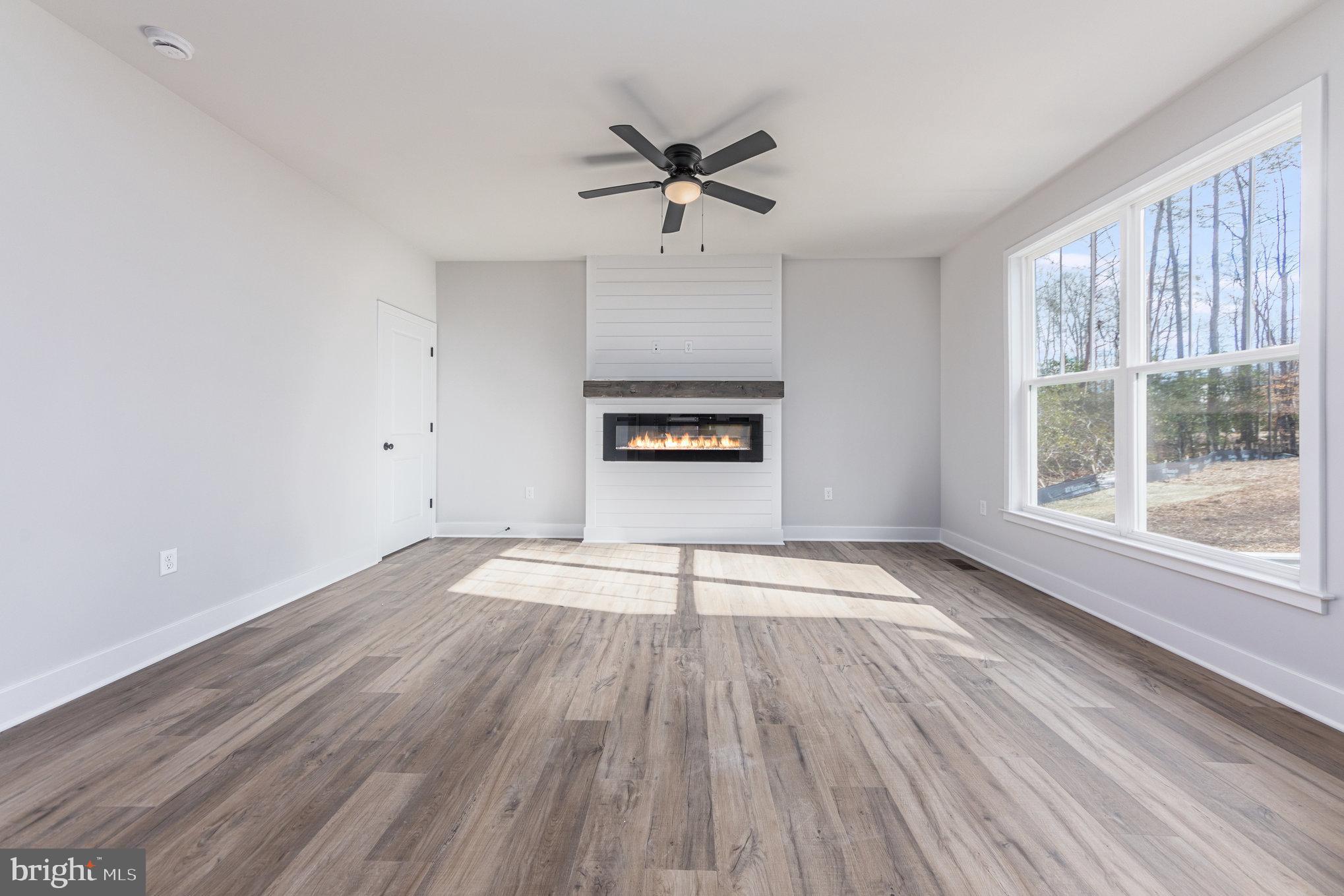 155 Norman Road Stafford, VA 22554 - Photo 14 of 55 wooden floor in an empty room with a window