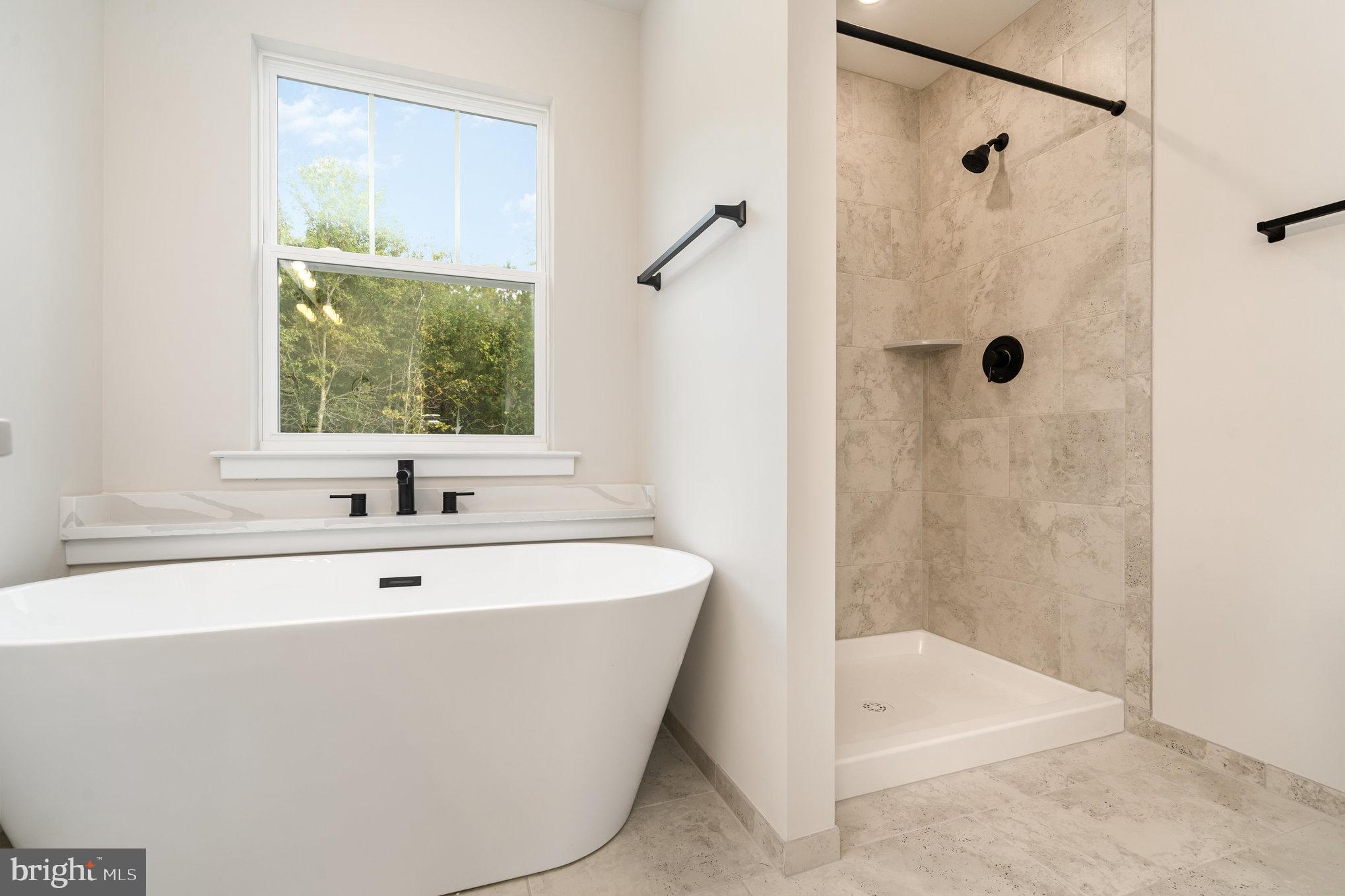 155 Norman Road Stafford, VA 22554 - Photo 35 of 55 a white bath tub sitting next to a shower