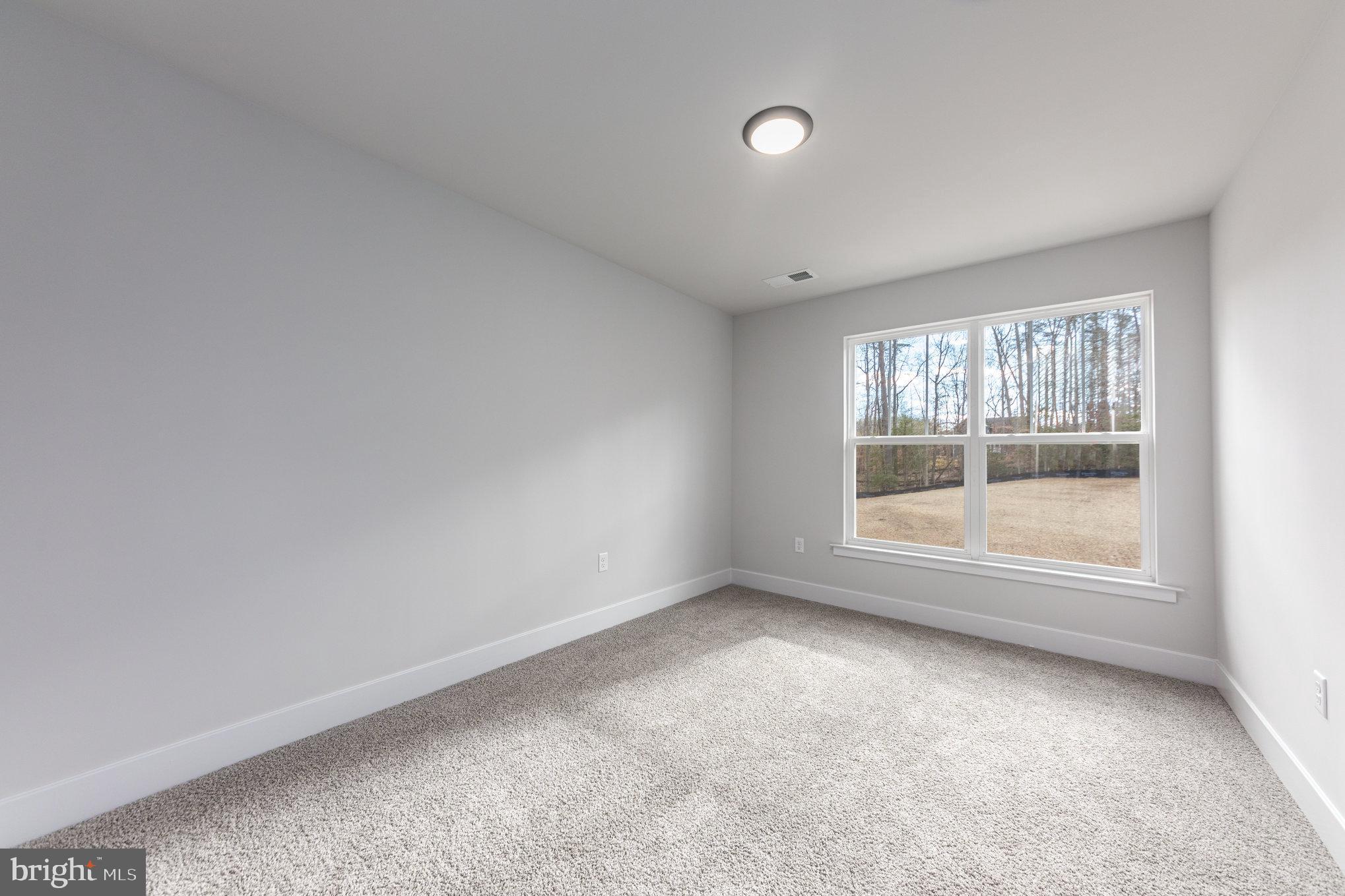 155 Norman Road Stafford, VA 22554 - Photo 41 of 55 an empty room with wooden floor and windows