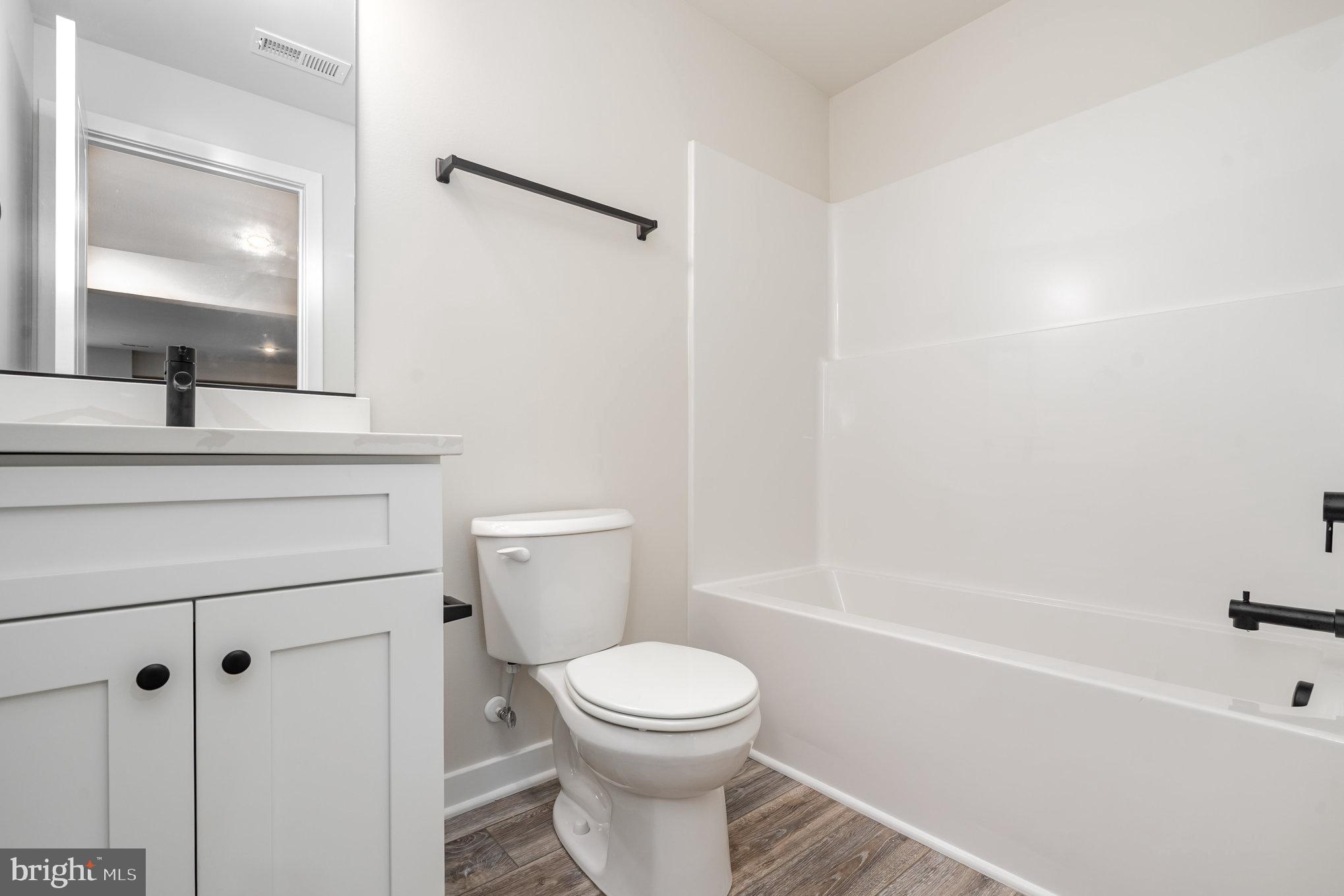 155 Norman Road Stafford, VA 22554 - Photo 44 of 55 a bathroom with a toilet sink and shower