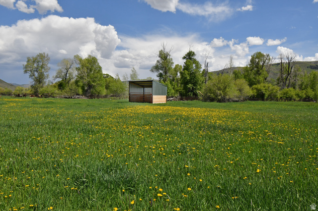 4347 South Bench Creek Road Kamas, UT 84036 - Photo 15 of 23 View of yard featuring a view of rural / pastoral area, an outdoor structure, a pole building, and a mountain view