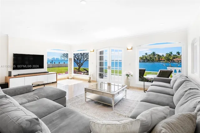 a view of a living room and floor to ceiling window