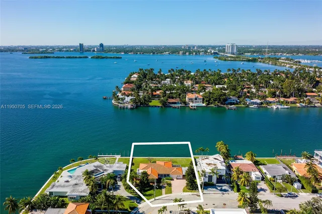 an aerial view of a house with a ocean view