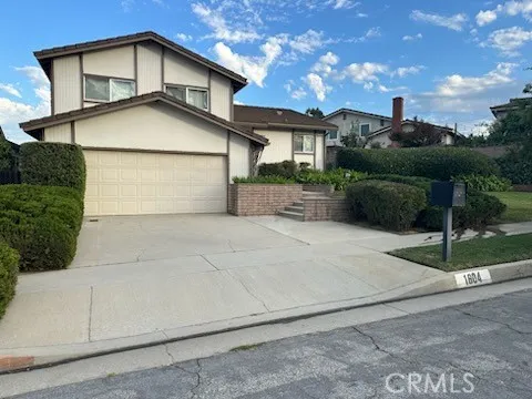 a view of a house with a street